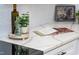 Close-up of a modern countertop featuring a designer cookbook and lovely decoratives at 4349 Pickwick Dr, Raleigh, NC 27613