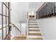 Bright entryway featuring wood stairs, modern railing and an open floor plan at 4349 Pickwick Dr, Raleigh, NC 27613