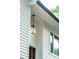 Exterior shot displaying updated outdoor lighting, and dark trim windows at 4349 Pickwick Dr, Raleigh, NC 27613