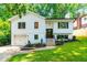 Charming two-story home features a freshly painted exterior, manicured landscaping, and an attached garage at 4349 Pickwick Dr, Raleigh, NC 27613