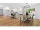 This open-concept kitchen and dining area features lots of natural light and stylish modern finishes at 4349 Pickwick Dr, Raleigh, NC 27613