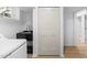Laundry room features a utility sink, bi-fold doors, and durable flooring at 4349 Pickwick Dr, Raleigh, NC 27613