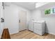 Laundry room features a washer, dryer, and built in cabinets at 4349 Pickwick Dr, Raleigh, NC 27613