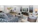Bright living room with modern furniture, sleek TV, and stylish decor for comfortable living at 4349 Pickwick Dr, Raleigh, NC 27613