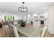 Open-concept design seamlessly connects the dining room, living space, and the well-equipped kitchen at 4349 Pickwick Dr, Raleigh, NC 27613