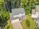 Scenic aerial view of a suburban home with mature landscaping and a private backyard at 4600 Landover Dale Dr, Raleigh, NC 27616