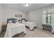 Well-lit bedroom featuring two beds, a window with natural light and cozy decor at 4600 Landover Dale Dr, Raleigh, NC 27616