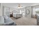 Spacious bedroom with large windows, ceiling fan and an elegant metal bed frame at 4600 Landover Dale Dr, Raleigh, NC 27616