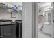 View of the laundry room with modern machines and shelving at 4600 Landover Dale Dr, Raleigh, NC 27616