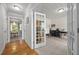 Bright home office featuring tile floors, neutral walls, a sewing machine, and stylish French doors at 4600 Landover Dale Dr, Raleigh, NC 27616