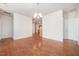 Spacious dining area with hardwood floors and a chandelier at 4622 Ivy Blossom Ln, Raleigh, NC 27604