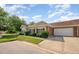 Exterior elevation showcasing the attached garage, well manicured lawn and brick accents at 4622 Ivy Blossom Ln, Raleigh, NC 27604