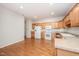 Bright kitchen with white appliances and lots of wooden cabinetry at 4622 Ivy Blossom Ln, Raleigh, NC 27604
