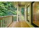 Relax on the spacious balcony overlooking the serene wooded landscape at 4831 Crestmore Rd # 202, Raleigh, NC 27612