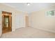 Neutral bedroom offering a large closet and a window for natural light at 4831 Crestmore Rd # 202, Raleigh, NC 27612