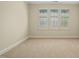 Neutral bedroom with carpet and a window allowing natural light at 4831 Crestmore Rd # 202, Raleigh, NC 27612