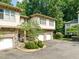 Beautiful townhome community features manicured landscaping and attached garages at 4831 Crestmore Rd # 202, Raleigh, NC 27612