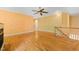 Spacious living room with hardwood floors, ceiling fan and bright paint at 4831 Crestmore Rd # 202, Raleigh, NC 27612