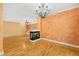 Living room featuring a fireplace and hardwood flooring at 4831 Crestmore Rd # 202, Raleigh, NC 27612