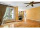 Cozy living room with fireplace, hardwood floors and large windows at 4831 Crestmore Rd # 202, Raleigh, NC 27612
