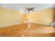 Spacious living room with hardwood floors, ceiling fan and bright paint at 4831 Crestmore Rd # 202, Raleigh, NC 27612