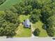 An aerial view of a charming home surrounded by lush trees and greenery at 4880 Old Us Hwy 64, Zebulon, NC 27597