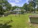Home aerial view highlighting a fenced in yard with mature trees at 4880 Old Us Hwy 64, Zebulon, NC 27597
