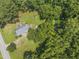 Aerial view of the property with mature trees at 4880 Old Us Hwy 64, Zebulon, NC 27597