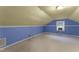 Bedroom featuring blue walls, light-yellow ceiling, and a window-mounted AC unit at 4880 Old Us Hwy 64, Zebulon, NC 27597
