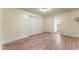 Bedroom with wood-look floors, painted walls, a closet, and a door to a bathroom at 4880 Old Us Hwy 64, Zebulon, NC 27597