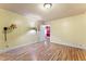 A bedroom with wood-look floors, painted walls, and an adjacent room in view at 4880 Old Us Hwy 64, Zebulon, NC 27597