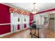 Classic dining area with hardwood floors, chandelier, and a bright window view at 4880 Old Us Hwy 64, Zebulon, NC 27597