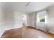 Well-lit living room featuring wood-look floors, and neutral wall paneling at 4880 Old Us Hwy 64, Zebulon, NC 27597