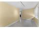 Bright room with yellow paneled walls and tile flooring under track lighting at 4880 Old Us Hwy 64, Zebulon, NC 27597