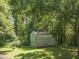 Outbuilding on property with lots of surrounding trees at 4880 Old Us Hwy 64, Zebulon, NC 27597
