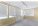 Sunroom with plenty of natural light and windows, painted walls, and tile floors at 4880 Old Us Hwy 64, Zebulon, NC 27597