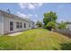 Large backyard with a wood fence, grass and mature tree at 5000 Mocha Ln, Raleigh, NC 27616
