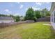 Backyard featuring a wood fence and mature trees at 5000 Mocha Ln, Raleigh, NC 27616