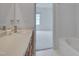 Bathroom with vanity and a view to the bedroom with neutral carpet at 5000 Mocha Ln, Raleigh, NC 27616