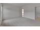 Spacious bedroom with neutral carpet and view into hallway and bath at 5000 Mocha Ln, Raleigh, NC 27616