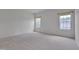 Spacious bedroom with neutral carpet and two windows at 5000 Mocha Ln, Raleigh, NC 27616