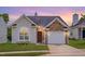 Charming home featuring stone accents, a well-maintained lawn, and an attached single car garage at 5000 Mocha Ln, Raleigh, NC 27616