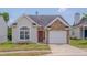 Charming home featuring stone accents, a well-maintained lawn, and an attached single car garage at 5000 Mocha Ln, Raleigh, NC 27616