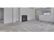 Neutral living room features a fireplace and an opening to the kitchen at 5000 Mocha Ln, Raleigh, NC 27616