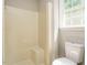 Bathroom features a bathtub shower and toilet near a window with natural light at 505 Commander Dr, Wendell, NC 27591