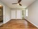 Spacious bedroom with hardwood floors, walk-in closets, and an attached bathroom at 505 Commander Dr, Wendell, NC 27591