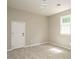 Bedroom featuring carpet, a window letting in natural light and a beaded light fixture at 505 Commander Dr, Wendell, NC 27591