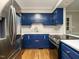 An elegant kitchen design featuring blue cabinets, stainless steel appliances, and stylish countertops at 505 Commander Dr, Wendell, NC 27591