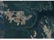 Aerial view showcases a waterfront community with lush greenery and access to Kerr Lake at 53 Stonewood Loop Ln, Henderson, NC 27537