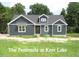 Charming, single-story home featuring gray siding, white trim, and inviting curb appeal in a serene neighborhood at 53 Stonewood Loop Ln, Henderson, NC 27537